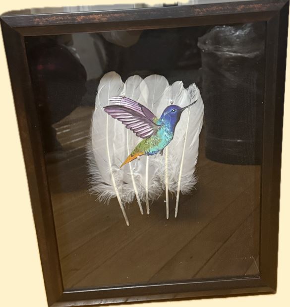 Detailed view of artist hands applying archival-quality paint to a canvas, ensuring the longevity and precision of the Woodland style artwork.